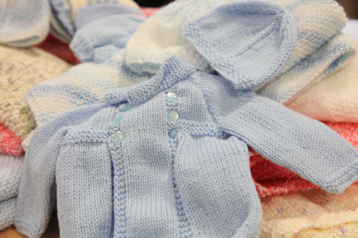 Blue knitted cardigan and hat